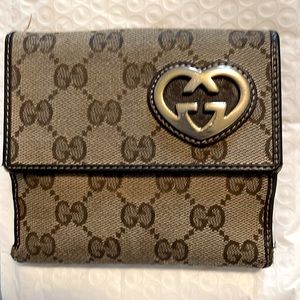 Used Gucci heart snap brown monogram wallet. A rare find!